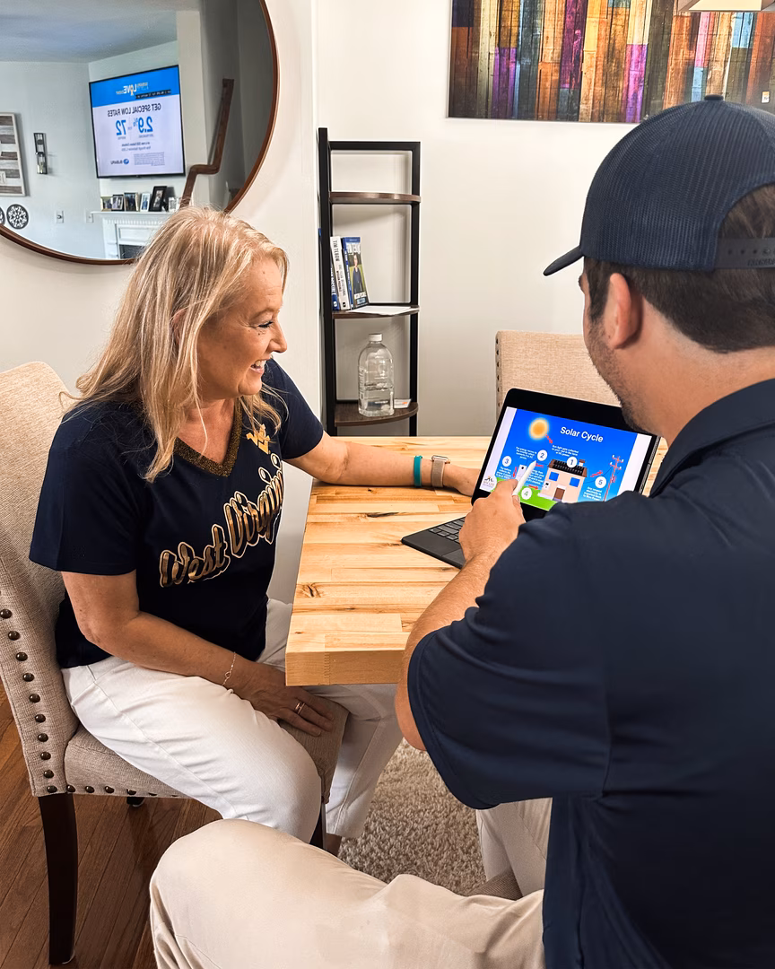 Homeowner reading FAQs on tablet