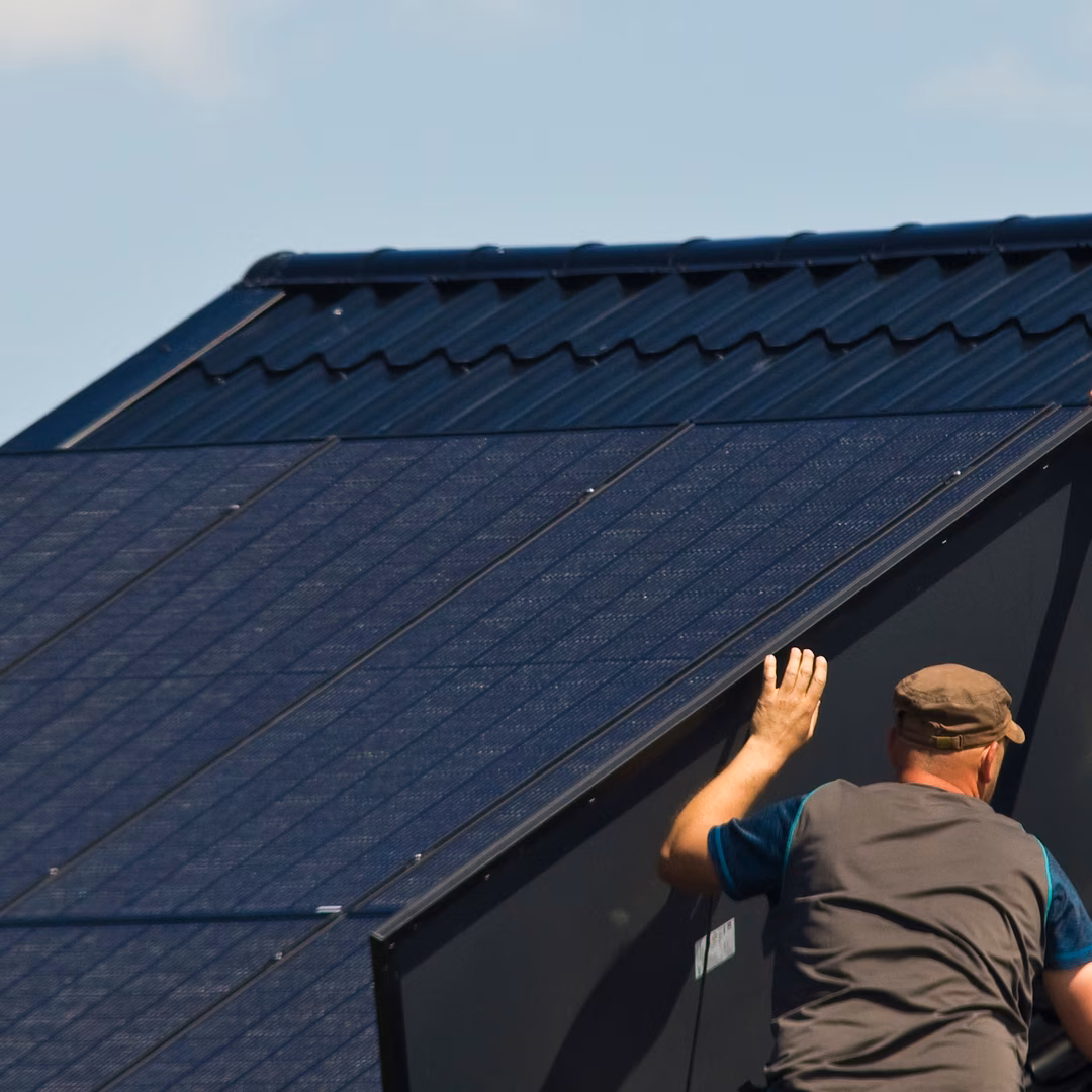 Solar installation technician on rooftop
